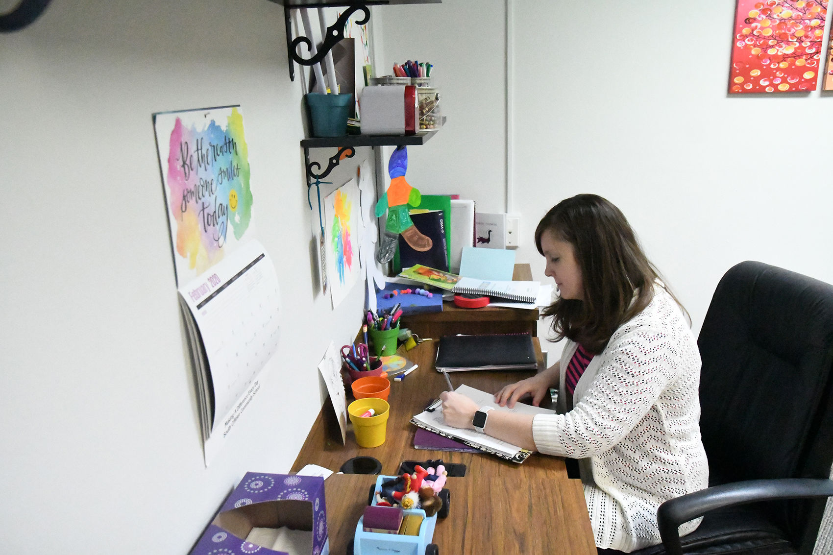 Erica Wassenaar at Sheldon office desk